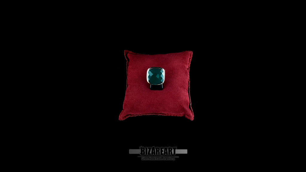 Byzantine sterling silver ring with green onyx displayed on red velvet pillow