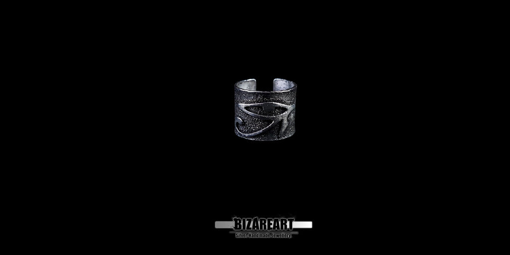 View of the adjustable silver ring band showing the open-back design