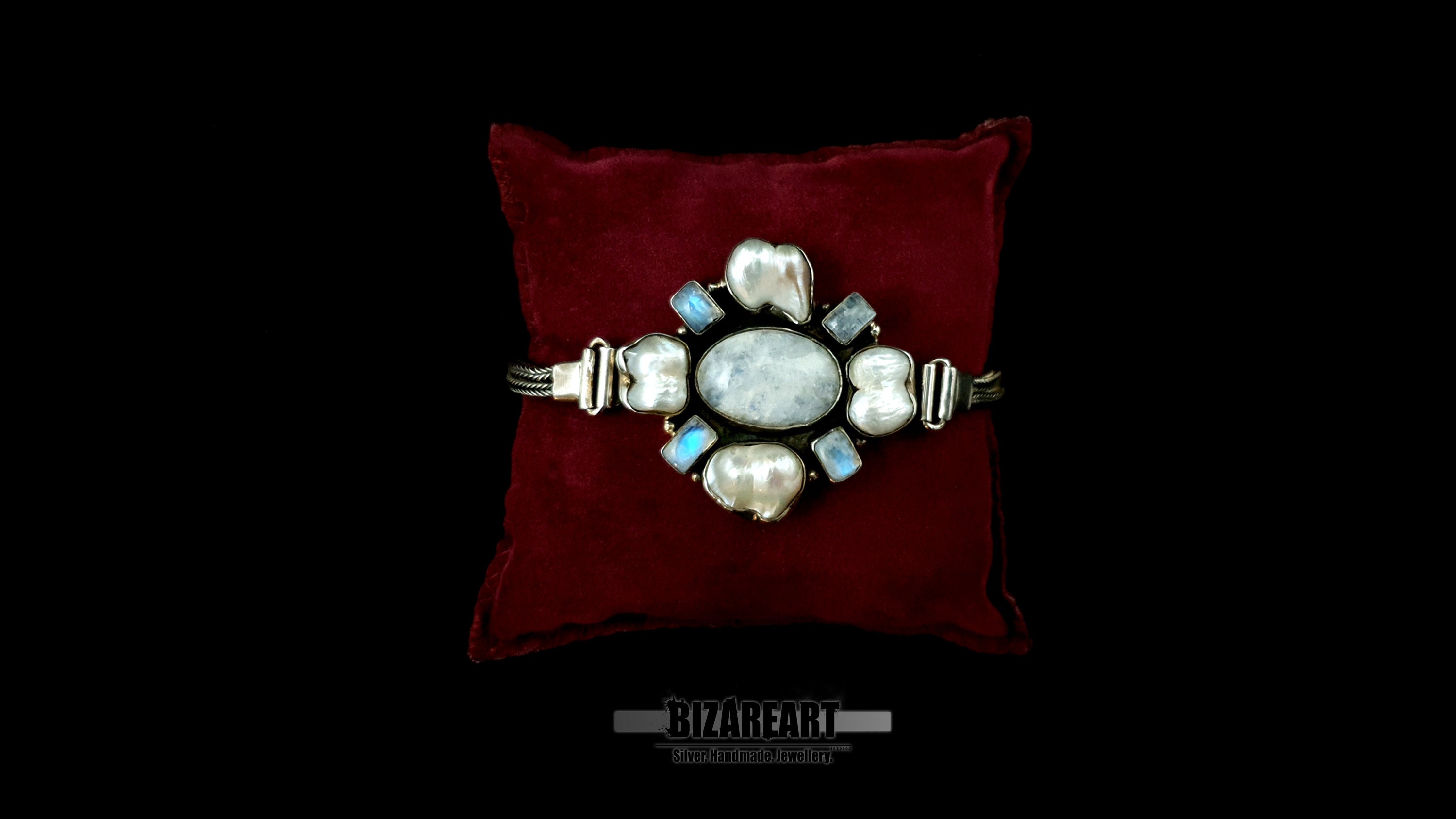 Close-up macro shot of central silver relic detailing the unique organic textures of 4 baroque pearls and the blue fire of 4 hand-set labradorite gems.