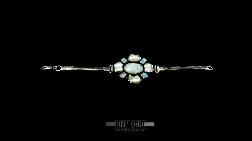 Left-to-right lay-flat view of the 35g sterling silver artisan bracelet highlighting the craftsmanship of its double woven chains and heavy clasp.